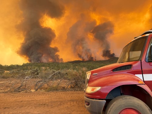 corner of fire truck during wildfire