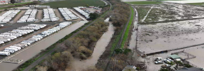 RVs surrounded by flood waters