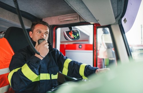 Fireman speaking into engine speaker